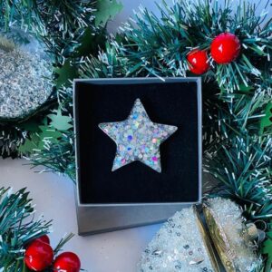 Silver holographic glitter star brooch boxed with festive background