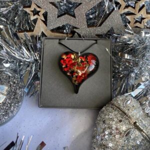 Black red and gold metallic sparkly heart on black cord chain gift boxed.